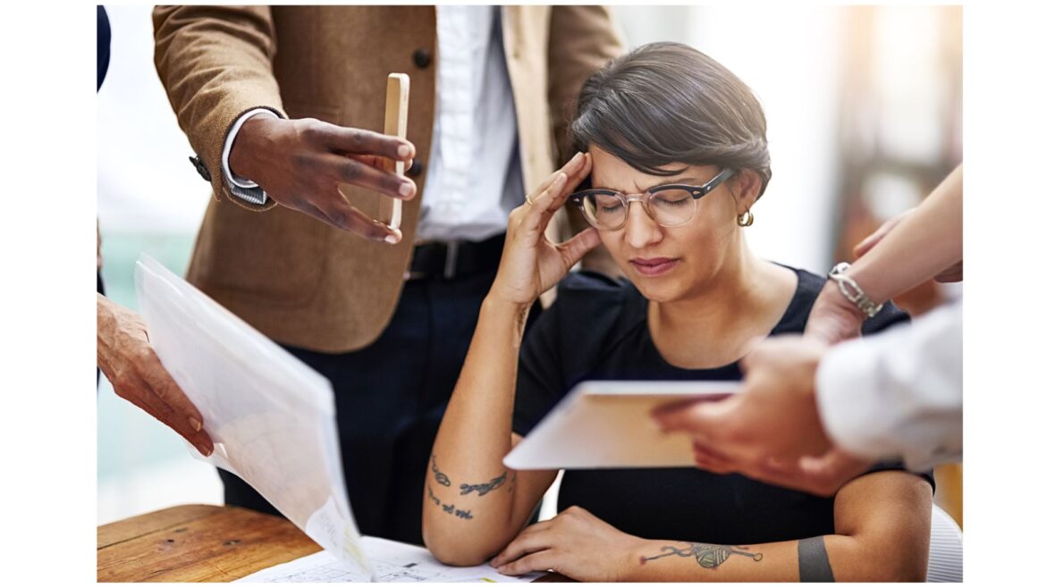 Mid-career professional showing signs of burnout at work.